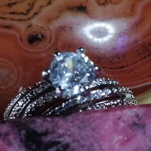 💥 MESMERIZING MOISSANITE, ACCENTED BY FACETED WHITE TOPAZ. STERLING, SIZE 6